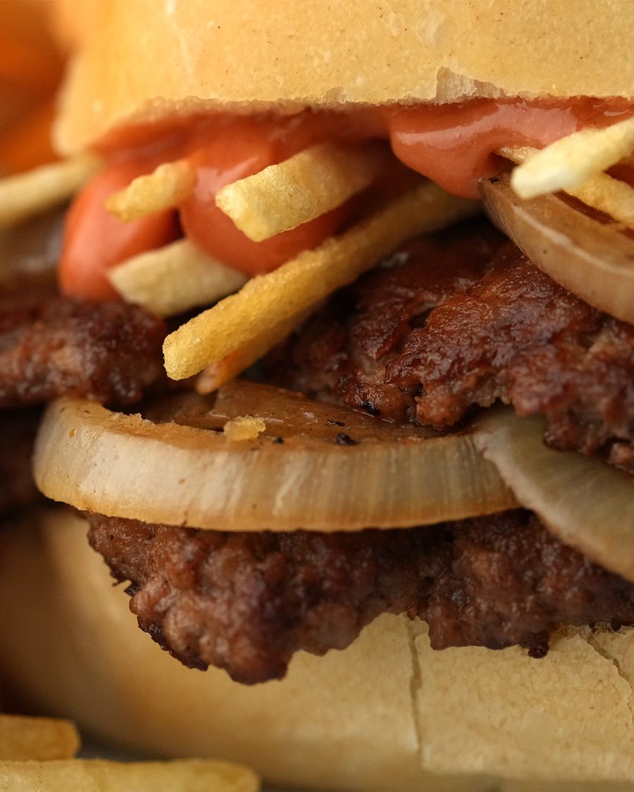 The Frita Cubana smashburger piled with potato sticks and tomato