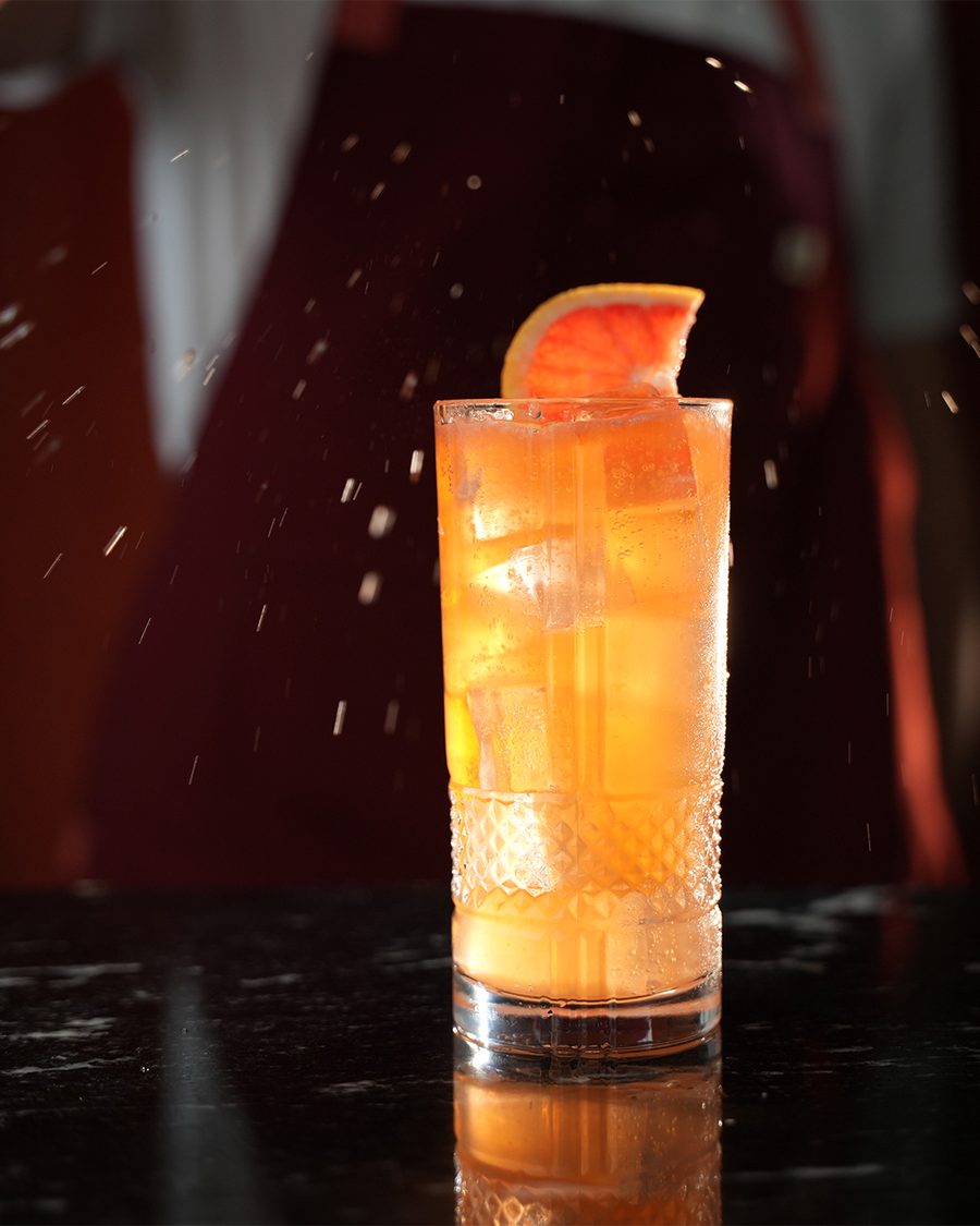 The Guayabita Paloma, a guava and grapefruit highball with a grapefruit wedge